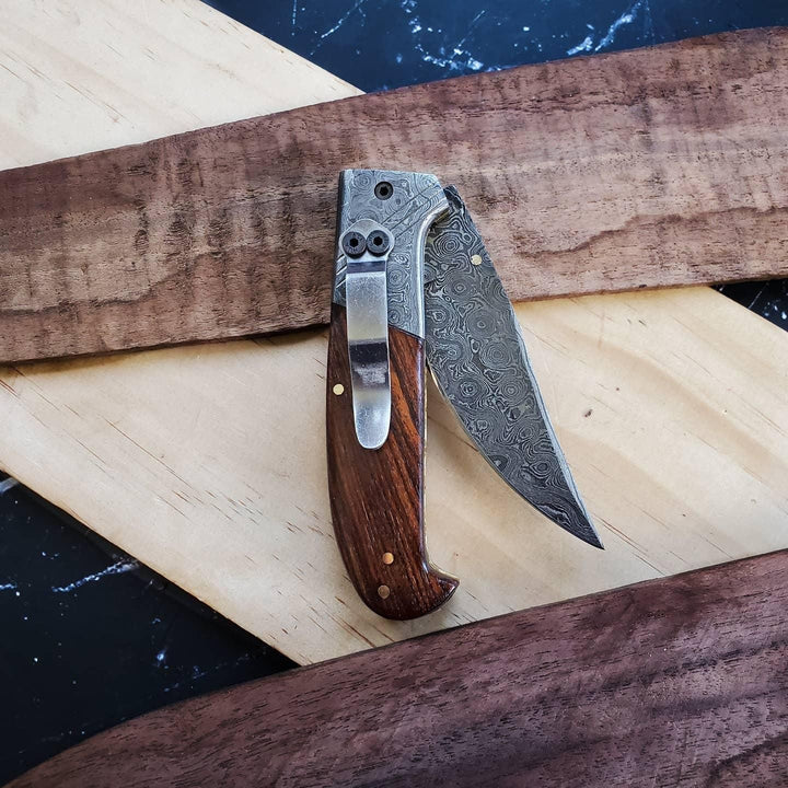 Damascus and walnut folding knife