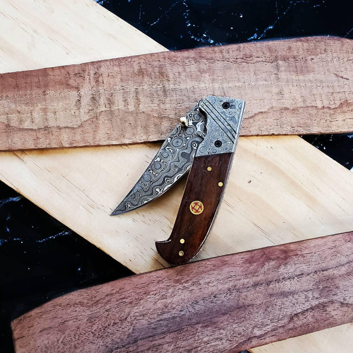 Damascus and walnut folding knife